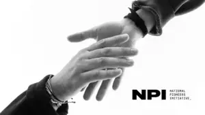 Two hands reaching towards each other in a black-and-white image, symbolizing connection and collaboration. NPI logo included.