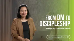 Woman presenting a workshop on online outreach, titled "From DM to Discipleship" with a laptop in her hands.