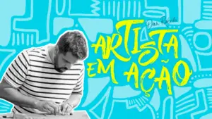 A focused artist sketching on paper, surrounded by colorful design elements and the text "Artista em Ação" in vibrant lettering.