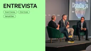 Three speakers discussing at Digital Day 24 event, seated on green chairs against a modern backdrop with event branding.