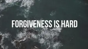 Aerial view of tumultuous ocean waves with bold text "FORGIVENESS IS HARD" conveying emotional struggle.