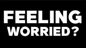 Bold text asking "Feeling Worried?" against a black background, conveying a sense of urgency and contemplation.