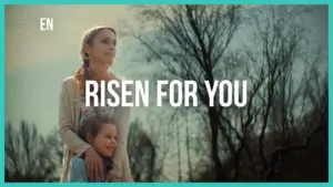 A mother and daughter embrace outdoors, with the text "RISEN FOR YOU" prominently displayed above them.