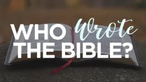 Open Bible on a stone surface with the text "Who Wrote the Bible?" creatively displayed above it.