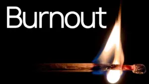 A burning matchstick with the word "Burnout" in bold white letters above, symbolizing stress and fatigue.