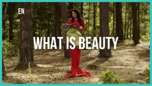 Woman in a flowing red dress holding a mirror in a serene forest, exploring the theme of beauty amidst nature.