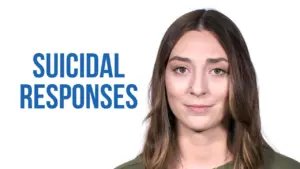 Young woman with a serious expression, addressing the topic of suicidal responses, against a plain white background.