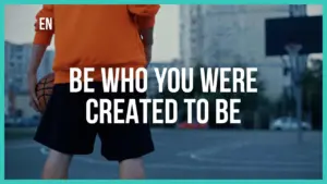 Person in orange hoodie holding a basketball on a court, with motivational text about self-identity and purpose.