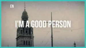 Towering historic building with text overlay reading "I'm a good person" evoking a sense of positivity and hope.