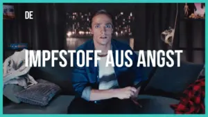 Man sitting on a couch, looking anxious while holding a remote, with a dark background and the text “Impfstoff aus Angst” displayed.