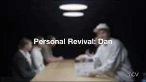 A group seated at a table, focused on a presenter holding a project box, showcasing the theme of personal revival.