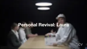 A dramatic meeting scene with four individuals at a table, focused on a person in white holding a box labeled "Personal Revival."