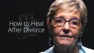 Woman with glasses expresses emotions while discussing healing after divorce, with text overlay about recovery strategies.