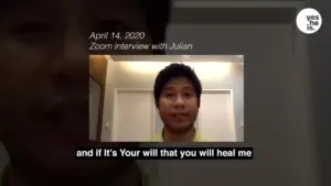 Young man speaking during a Zoom interview, featuring subtitles and a date in the corner.