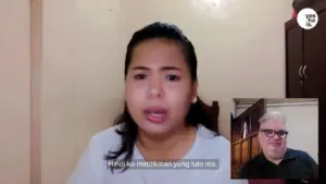 A woman speaking passionately on video call, with subtitles displayed, emphasizing her message and engagement.