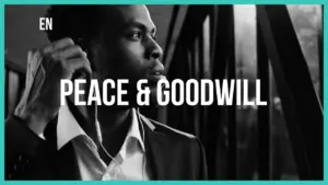 Man in a suit looking thoughtfully out a window, with the text "Peace & Goodwill" prominently displayed.