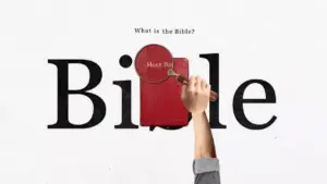 A hand holding a magnifying glass over a red Bible, emphasizing its significance with bold text in the background.