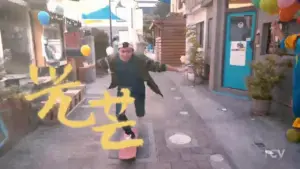 Person skateboarding down a vibrant street, surrounded by shops and colorful balloons, with playful text overlay.