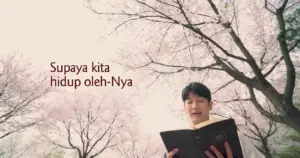 Person reading a book under blooming cherry blossom trees, with a serene atmosphere and inspirational text in the background.