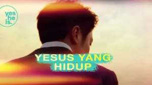 Man in a suit facing a sunrise with vibrant colors and text "Yesus Yang Hidup" above, conveying hope and inspiration.