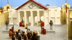 Colorful LEGO scene depicting a historical gathering in front of a grand building with statues and soldiers.