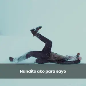 A person falling on an icy surface, expressing surprise and humor amidst snowflakes.