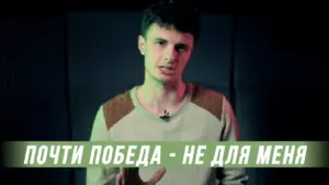 Young man speaking passionately against a dark background, with green lighting and text overlay in Russian.