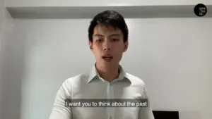 Young man in a white shirt speaking in front of a plain background, with subtitles reflecting introspective message.