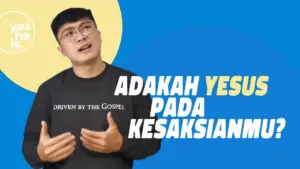 A young man in glasses speaks passionately against a vibrant blue background, discussing faith and personal testimony.