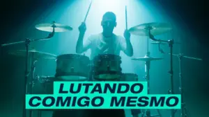 Drummer performing passionately under dramatic lighting, with a vibrant blue hue and strong focus on musical energy.