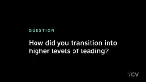 Text on a black background asking, "How did you transition into higher levels of leading?" in a minimalistic style.