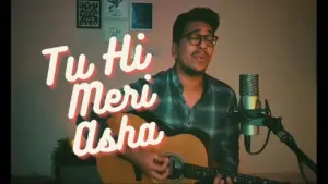 Young man singing and playing guitar in a cozy room, with "Tu Hi Meri Asha" displayed in a vibrant font.