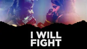 Two female fighters face off, determined expressions, with a dramatic backdrop and the text "I WILL FIGHT" below.