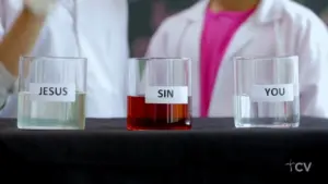 Three glasses labeled Jesus, Sin, and You, showcasing contrasting liquids to illustrate a spiritual concept.