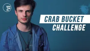 Young man in blue jacket promoting the Crab Bucket Challenge against a teal background with bold text.