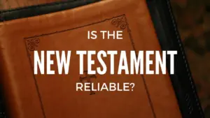 Close-up of a leather-bound text with the question "Is the New Testament reliable?" prominently displayed.