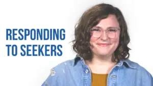 A smiling woman with curly hair in a denim jacket, promoting a message about responding to seekers.