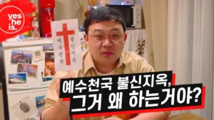 A man discussing religious themes, with a sign and decorations in the background, highlighting cultural context.