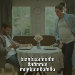 Couple at home enjoying a meal together, with the woman visibly pregnant, creating a warm and intimate atmosphere.