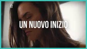 Woman with long hair looking down, surrounded by soft light, with text "Un Nuovo Inizio" prominently displayed.