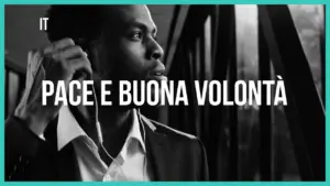 Man in a suit listening to music, with text overlay reading "Pace e buona volontà" in a modern, minimalist style.