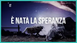 Night sky with a manger scene and text in Italian, "È nata la speranza" conveying a hopeful, festive atmosphere.