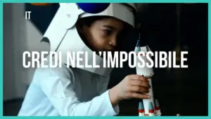 Child in an astronaut costume working on a model rocket, embodying creativity and imagination in a playful setting.