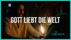 A scene from "The Chosen" featuring a man speaking by candlelight with the phrase "Gott liebt die Welt" displayed prominently.