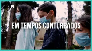 Children wearing masks walking in a serene park, reflecting on the theme "In Troubling Times."