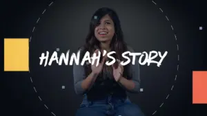 Young woman smiling and clapping, sharing her personal story, highlighted by bold text "HANNAH'S STORY" on a dark background.