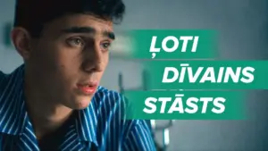 A close-up of a young man with a pensive expression, featuring the text "Loti divains statsts" in bold green letters.