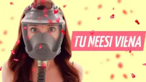 Woman wearing a gas mask surrounded by colorful petals, showcasing a bold and unique style in a vibrant setting.