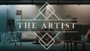 Art studio interior with spotlight, tools, and paintings, featuring the title "The Artist" in an elegant geometric design.