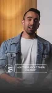 Man in denim jacket engaging with the camera, promoting cultural conversation with text overlay.